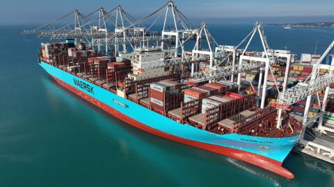Container ship loaded with cargo at a port terminal