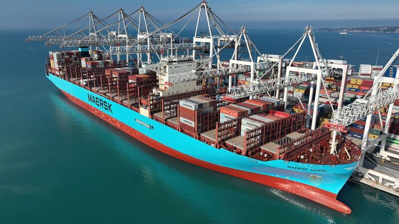 Container ship loaded with cargo at a port terminal