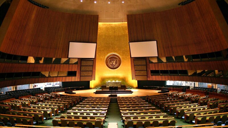UN General Assembly hall with delegates desks