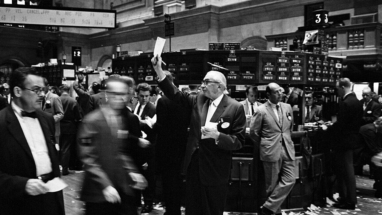 Traders on a stock exchange floor in a historic photograph