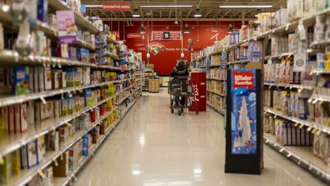 Grocery store aisle with stocked shelves