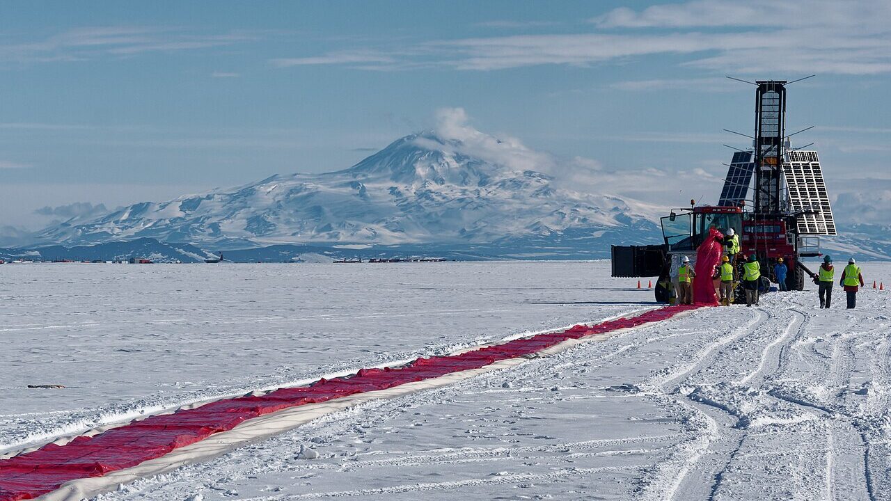 Scientific balloon launch site on snow with mountains
