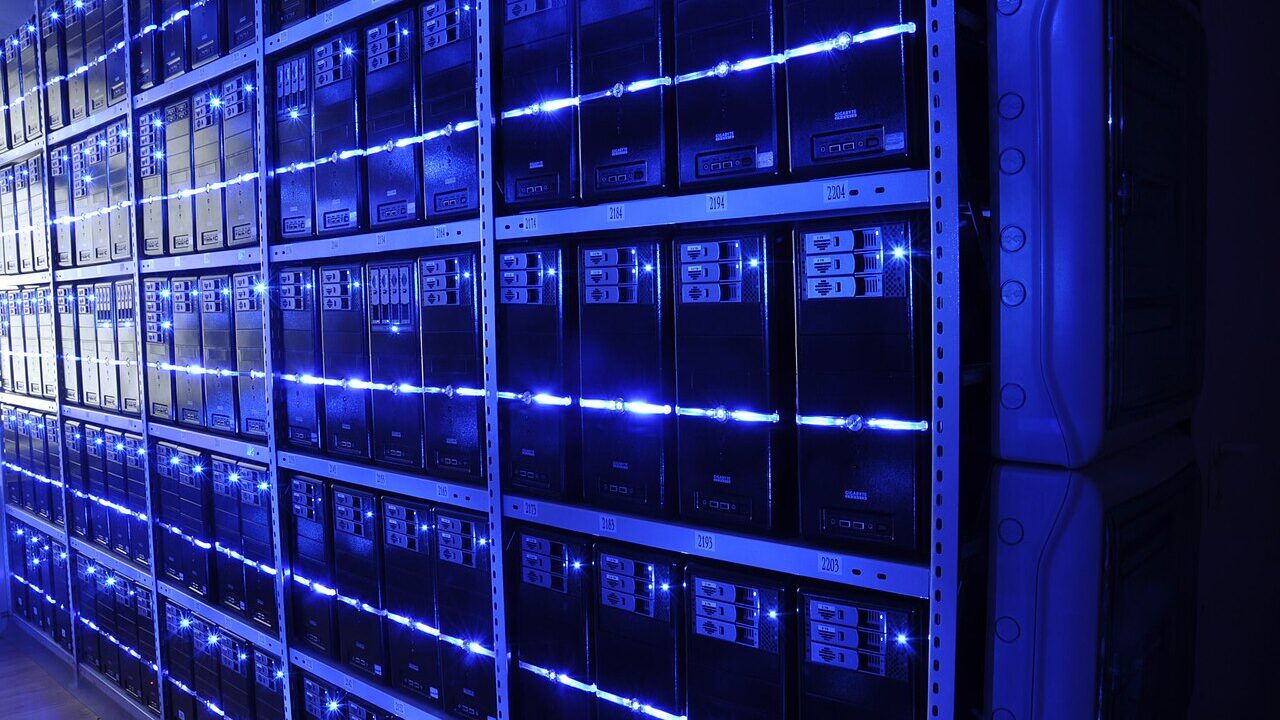 Rows of servers in a data centre with blue lighting