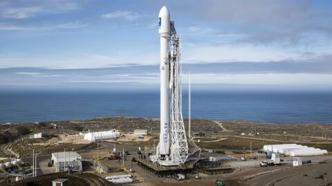 Falcon rocket on a coastal launch pad