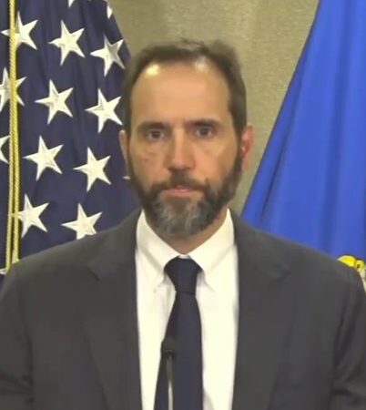 Former special counsel Jack Smith speaking at a podium