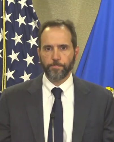 Former special counsel Jack Smith speaking at a podium